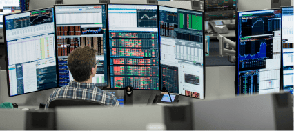 Trader looking at his screens