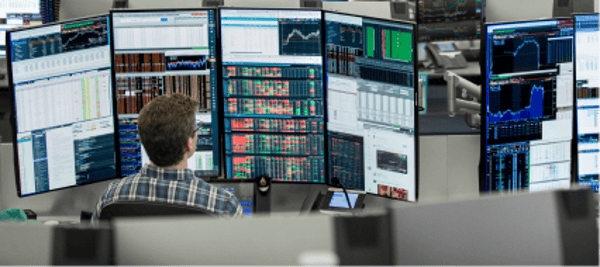 Trader looking at his screens