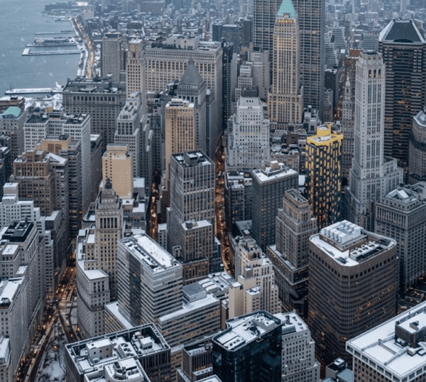 Lower Manhattan’s skyscrapers seen from above, with the Hudson River behind them